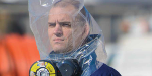 Man wears ILC Dover's SCape® CO/CBRN30 escape respirator system